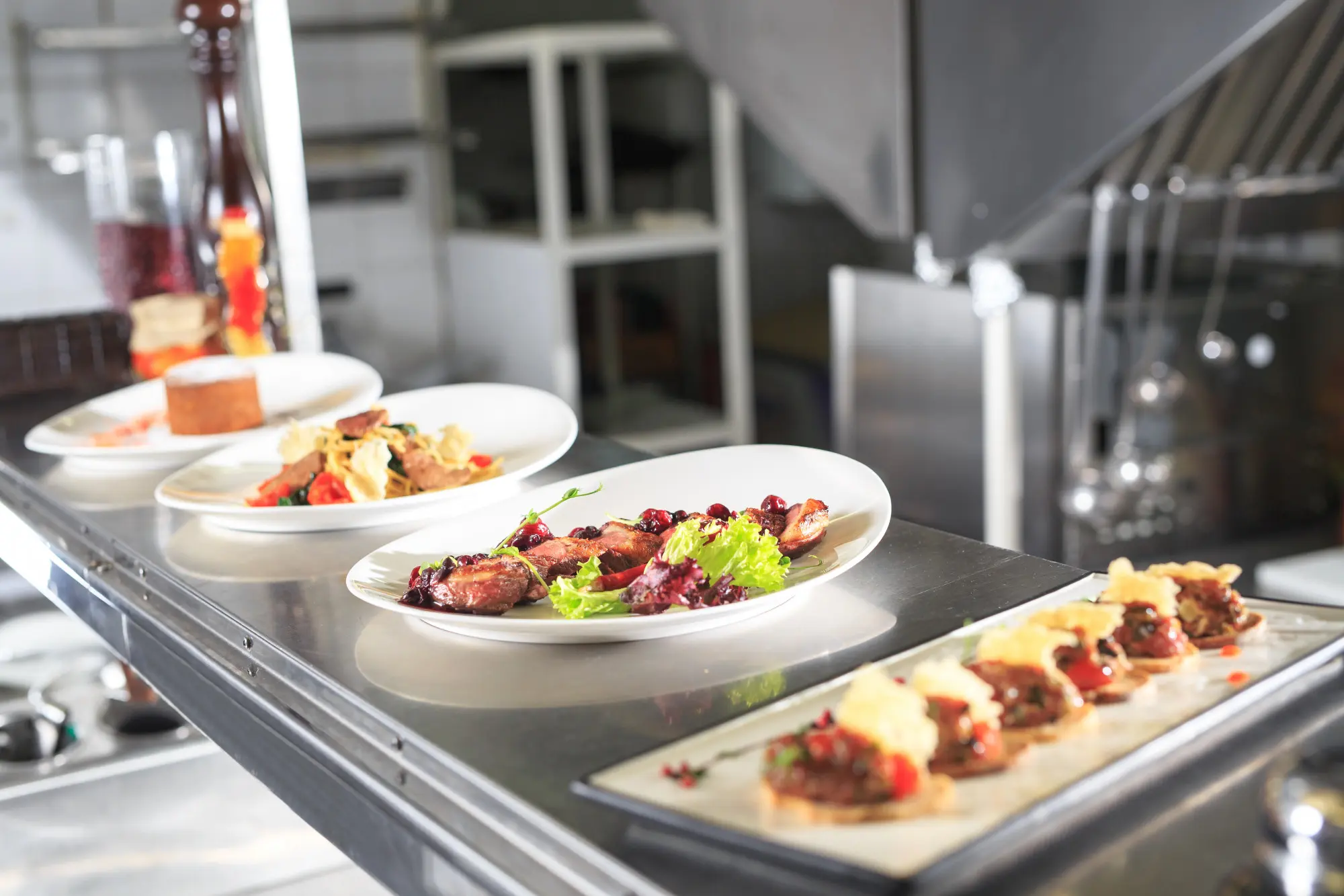 Food handler in a professional kitchen preparing food safely